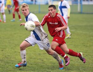 athletes playing soccer