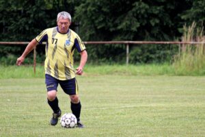 Adult man playing soccer