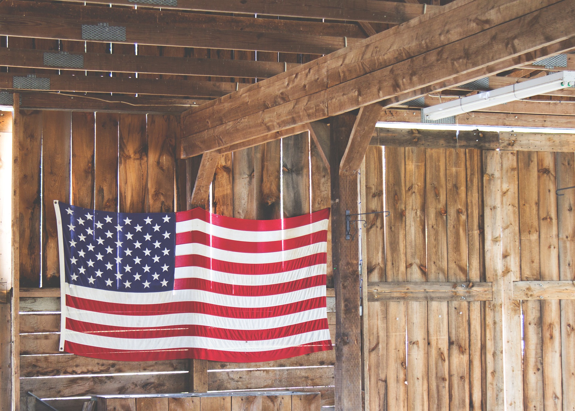 American Flag hanging in a barn