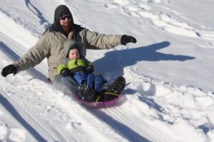 Father and Child sledding