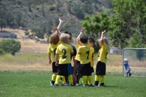 kids playing team soccer