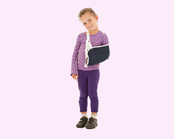 Young girl wearing an arm brace seeking trauma & fracture care