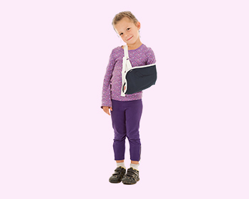 Young girl wearing an arm brace seeking trauma & fracture care