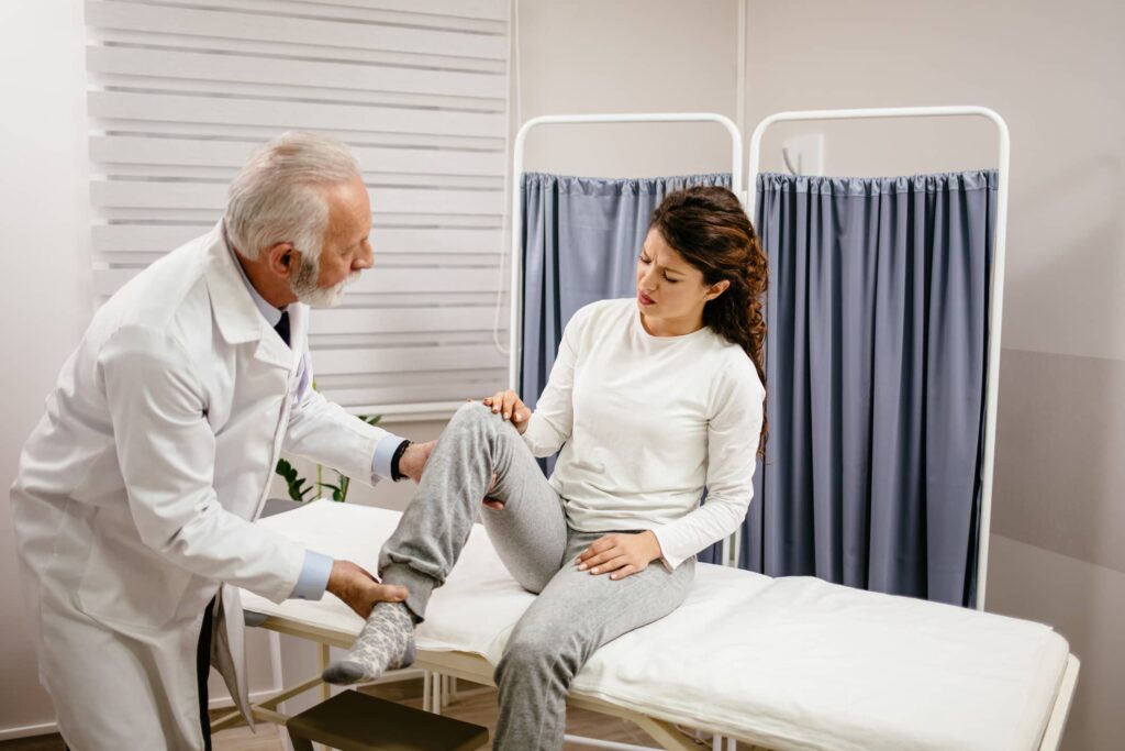 Doctor evaluating a patient to see if she will need MCL Surgery