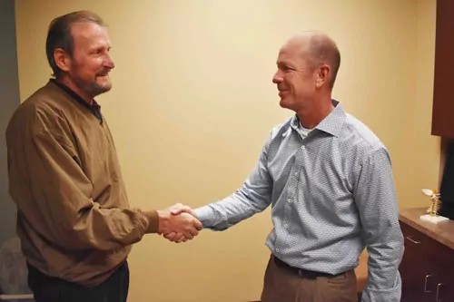 Dr. Bee handshake with patient